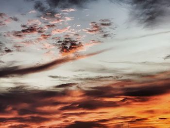 Low angle view of dramatic sky during sunset