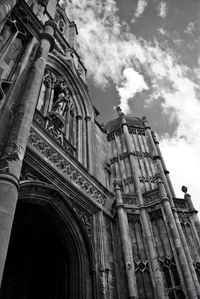 Low angle view of historic building against cloudy sky