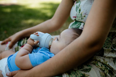 Midsection of mother and baby boy