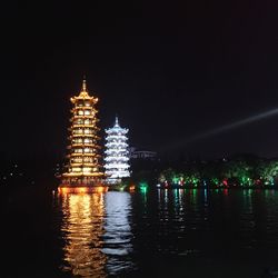 Reflection of illuminated buildings in water