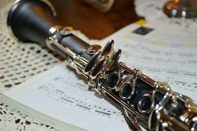 Close-up of instrument on sheet music