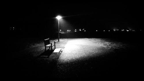 Illuminated street light at night