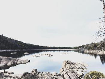 View of calm lake against clear sky