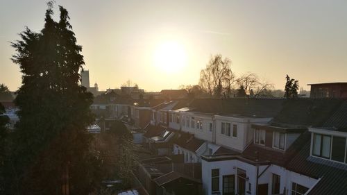 Panoramic view of city against sky at sunset