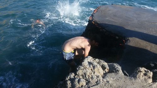 High angle view of man swimming in sea