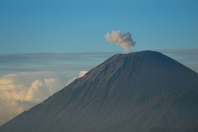 Scenic view of volcanic mountain against sky