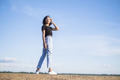 Happy young asian girl with blue sky.