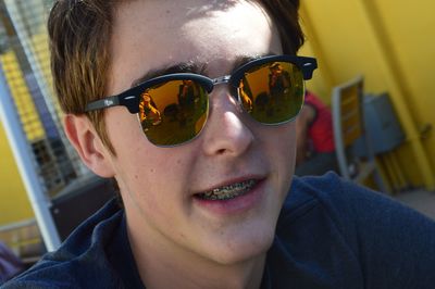 Close-up of teenage boy wearing sunglasses