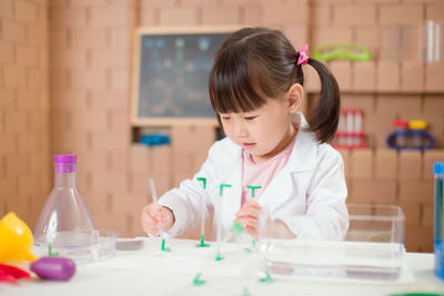 Girl sitting on table