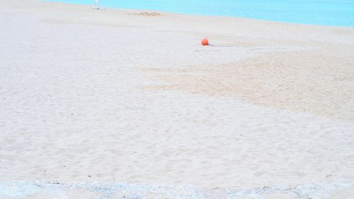 High angle view of white sandy beach at okinawa