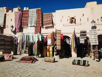 Low angle view of clothes for sale at market stall