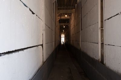 Empty alley amidst buildings