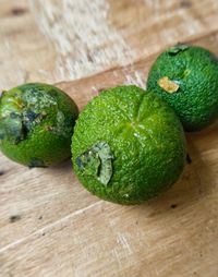 Close-up of green fruits on table