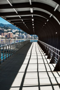 Sunlight falling on footbridge at harbor