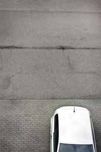 Close-up of car on road