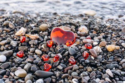 High angle view of stones with heart shapes at beach