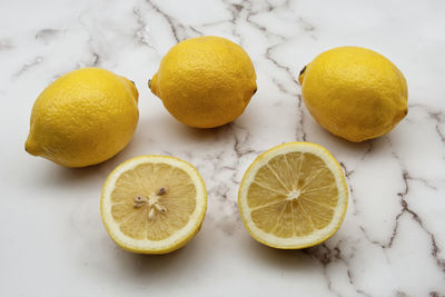 Close-up of lemon slices on white background