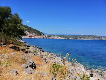 Scenic view of sea against clear blue sky