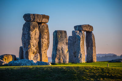 Built structure on field against clear sky