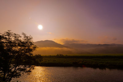 Scenic view of lake against sky during sunset