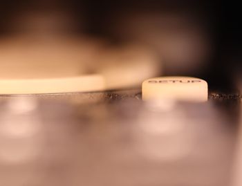 Close-up of telephone booth on table