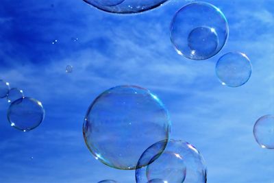 Low angle view of bubbles against moon
