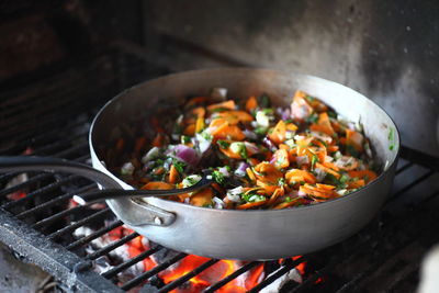 Fresh vegetables in pan on barbecue grill