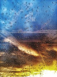 Full frame shot of raindrops on window