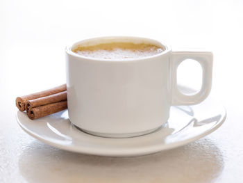 Close-up of coffee on table against white background