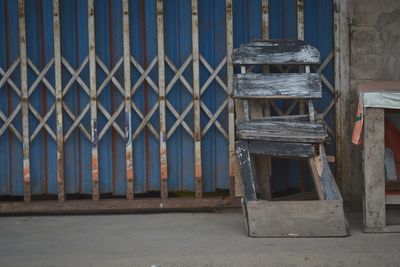 Metal fence against old building