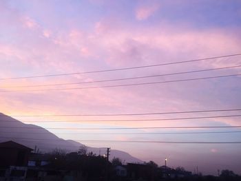 Low angle view of silhouette buildings against sky during sunset