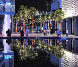 Group of people in front of building at night