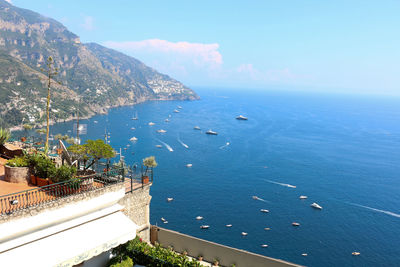 High angle view of sea and buildings against sky