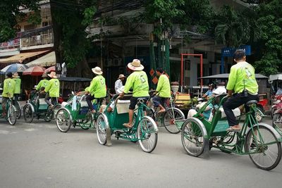Full length of people on bicycle