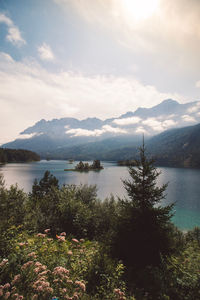 Scenic view of lake and mountains against sky