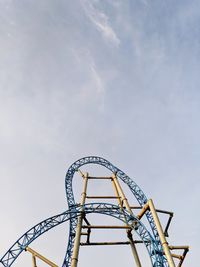 Low angle view of rollercoaster against sky