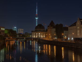 Illuminated buildings in city at night