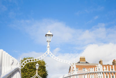 Low angle view of building against cloudy sky