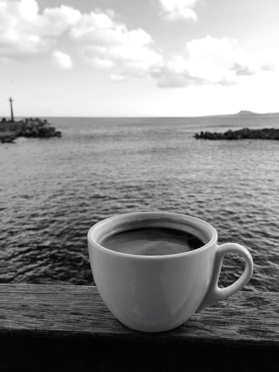 drink, coffee cup, food and drink, water, refreshment, no people, sea, horizon over water, coffee - drink, table, sky, tranquility, nature, close-up, day, freshness, scenics, beauty in nature, outdoors