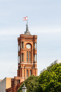 Low angle view of clock tower against sky