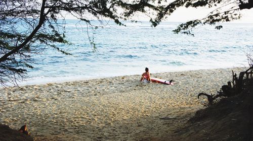 Woman sitting on beach