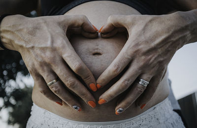 Close-up of hands holding heart shape