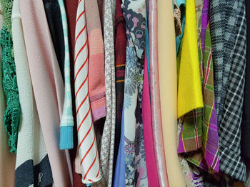 Full frame shot of multi colored clothes hanging on display at store