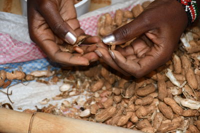 Cropped hand of person preparing food