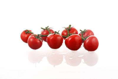 Close-up of cherry tomatoes against white background