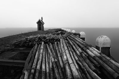 Scenic view of sea and building against clear sky