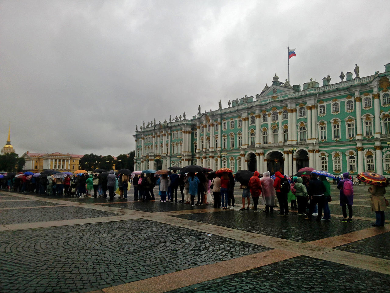 large group of people, travel destinations, city, patriotism, flag, architecture, history, tourism, built structure, people, building exterior, men, outdoors, crowd, sky, politics, adult, adults only, day, city gate