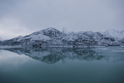 Scenic view of frozen lake against sky