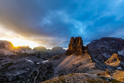 Scenic view of snowcapped mountains against sky during sunset