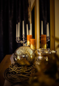 Close-up of illuminated glasses on table